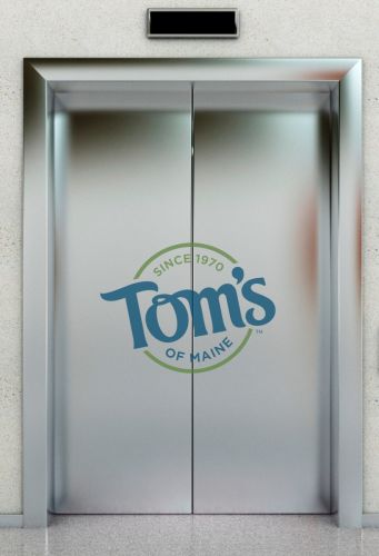 image of elevator door with tom's of maine logo on it